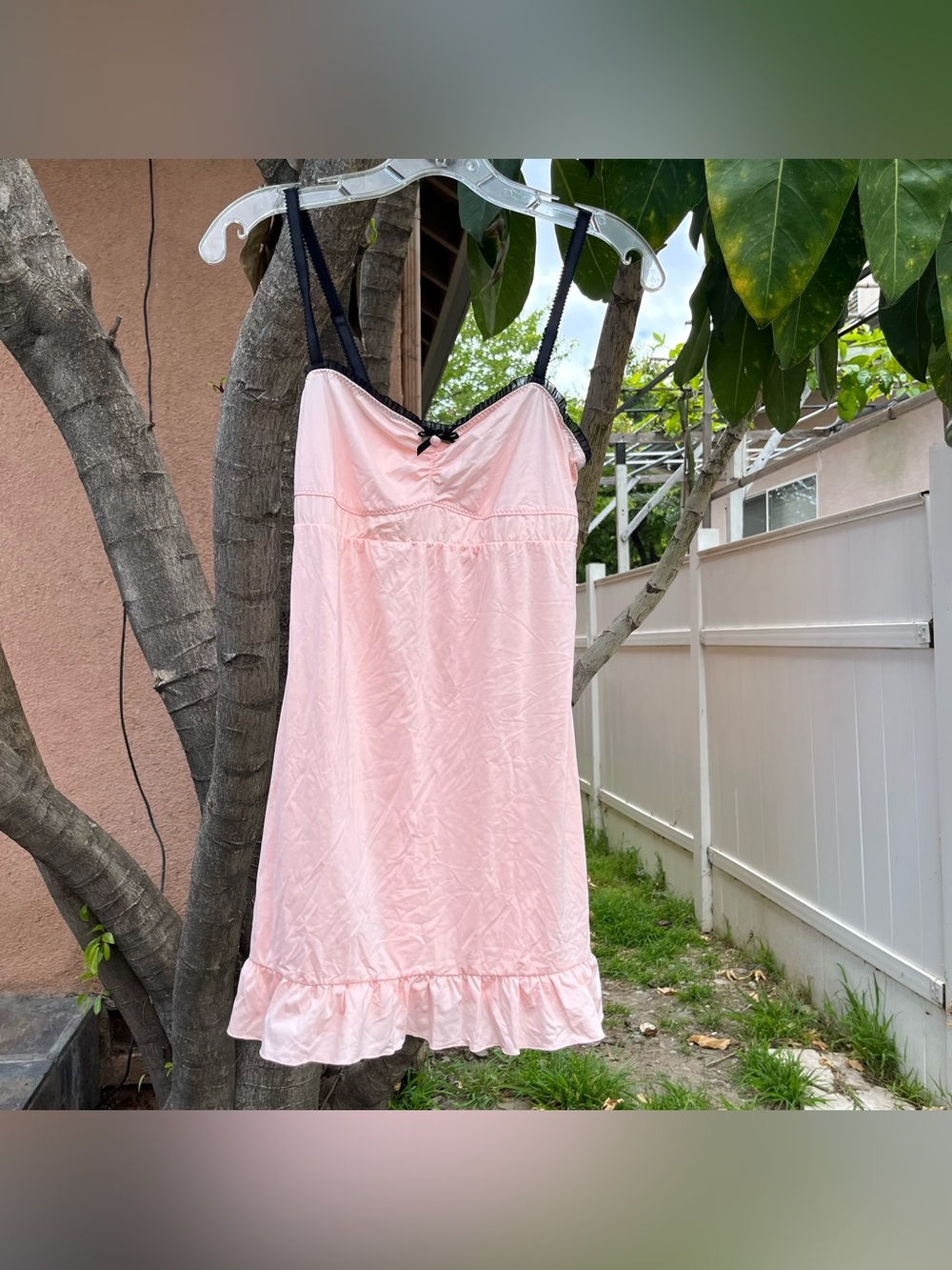 Light Pink Slip Dress with a Rose and Small Bow Detailing.